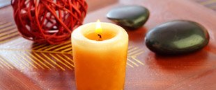 Beeswax candle on coffee table